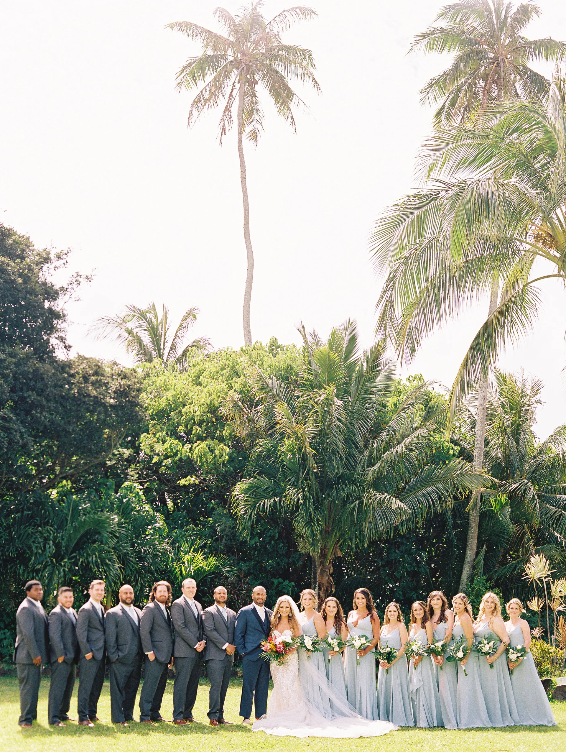 Wedding party at Loulu Palms in Oʻahu with tropical greenery and elegant floral arrangements. — Wedding Event Oahu Hawaii Florals Flowers Florist Creative Concepts by Jeff Alencastre